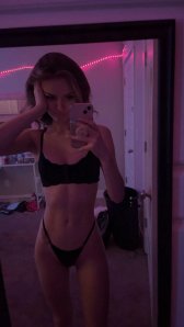 Petite woman posing to see if she fits in with the community