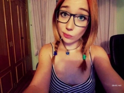 Private erotica of a redhead who is photographed in different poses