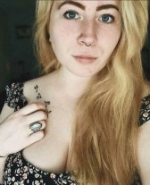 Sexy redhead woman posing confidently showing off her attractive figure