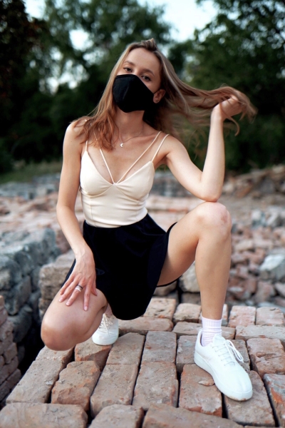 Girl in a mask and a skirt without panties