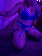 Adorable girl in blue praying her boyfriend remains clueless