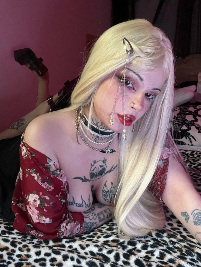 Woman with large breasts displaying deep cleavage in low cut top