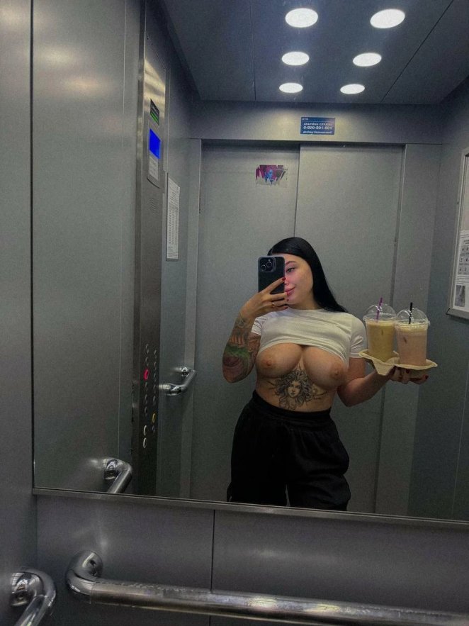 Feeling self-conscious about displaying my large breasts in the elevator