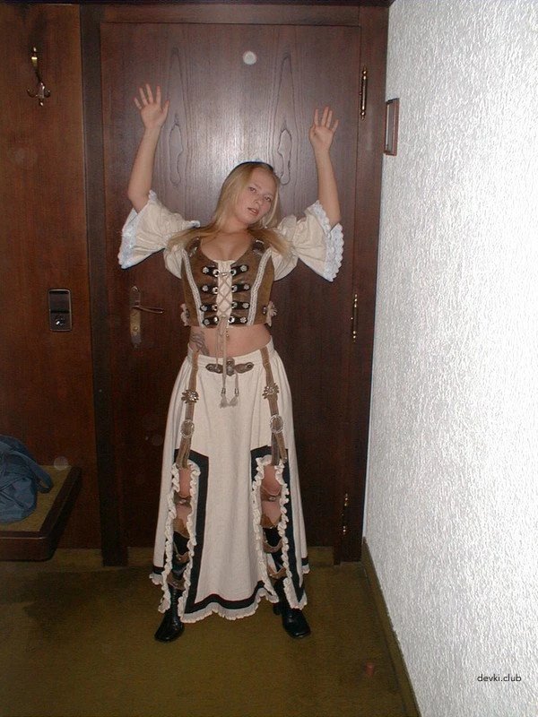 The blonde takes off her dress and masturbates