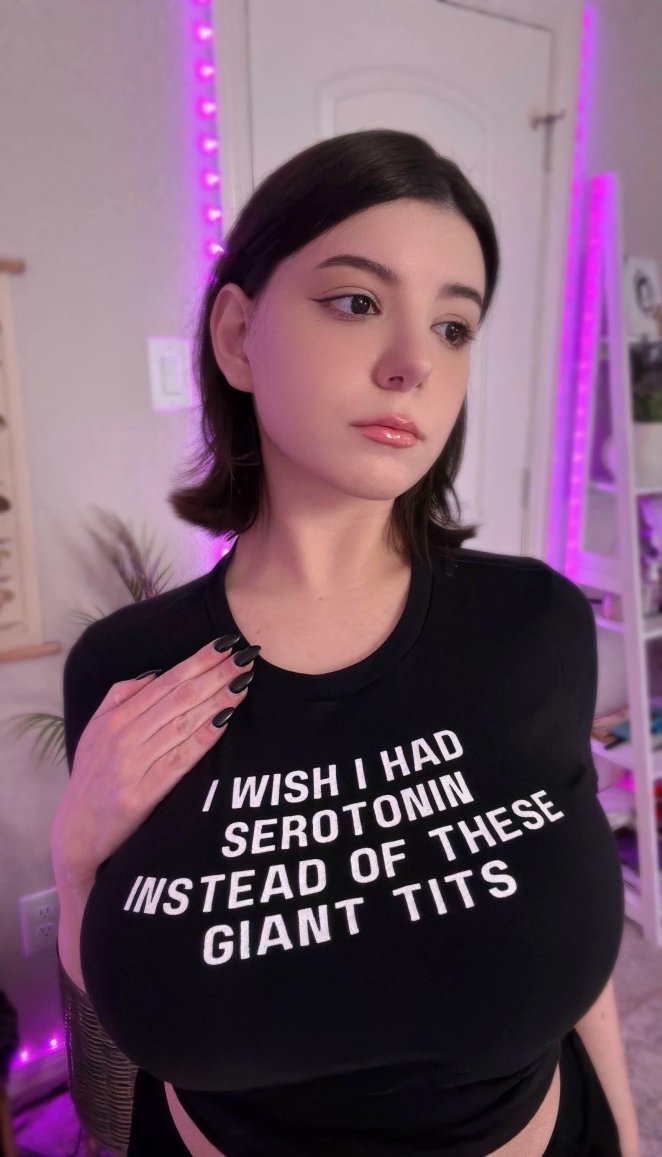 Curvy mixed Asian woman showing off her large natural bust