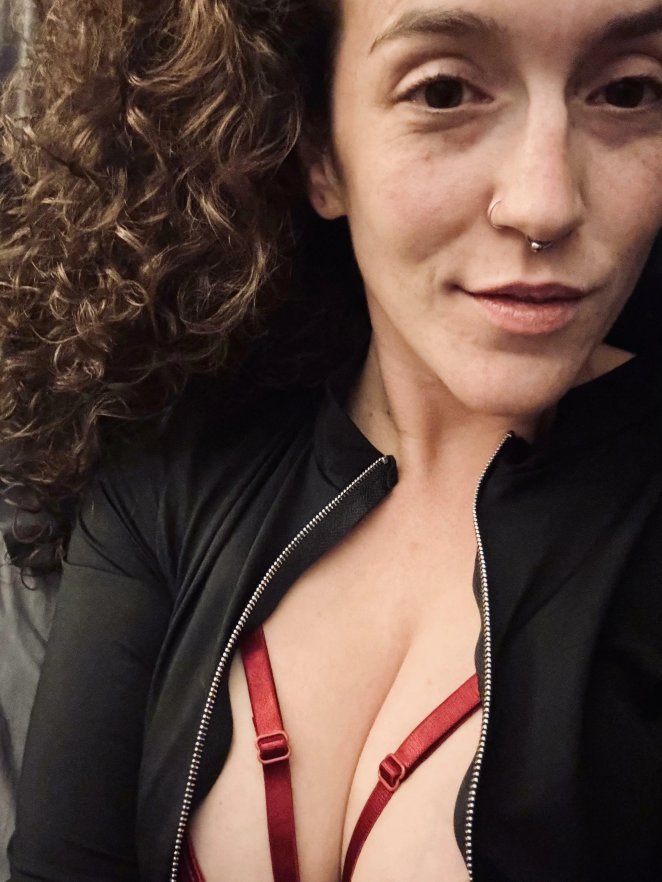 Close up of soft cleavage shown off in a low cut top