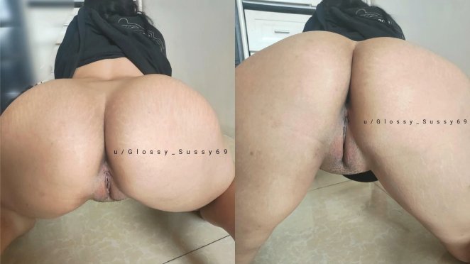 Asian woman posing seductively, looking at the camera with a flirtatious expression