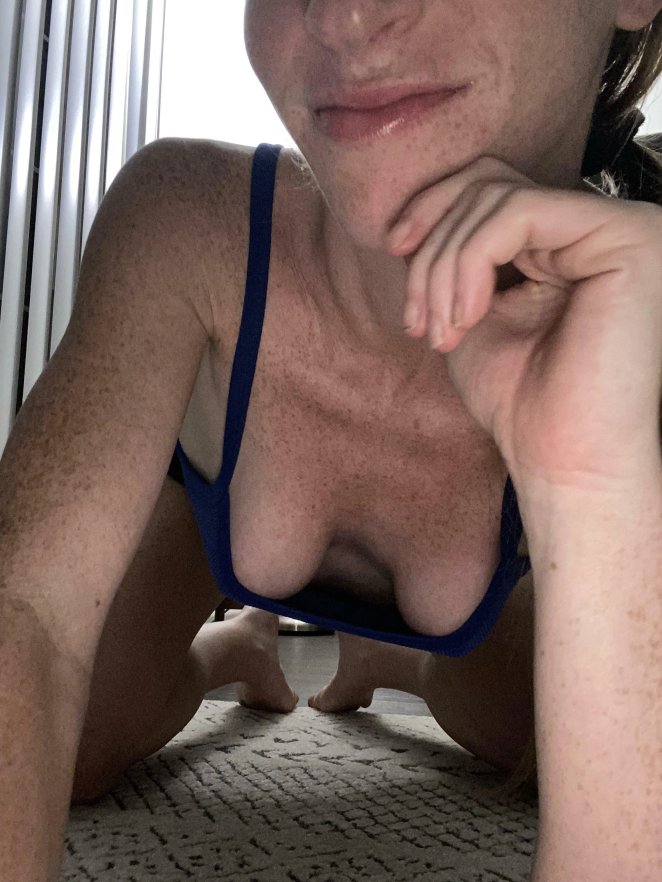 Woman showing natural cleavage through low-cut top while out in public