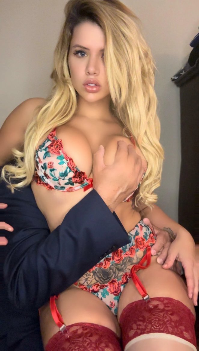 Mature woman posing seductively, inviting her husband to share her with others