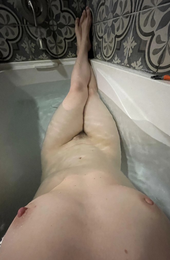 Pale 41 year old woman posing confidently for a self portrait photo