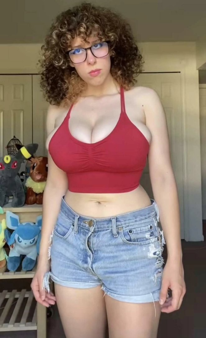 Unhappy with her oversized breasts spilling out of her shirt