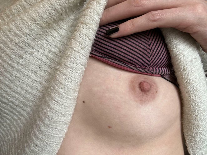 Slim petite woman posing seductively, showing off her small slender figure