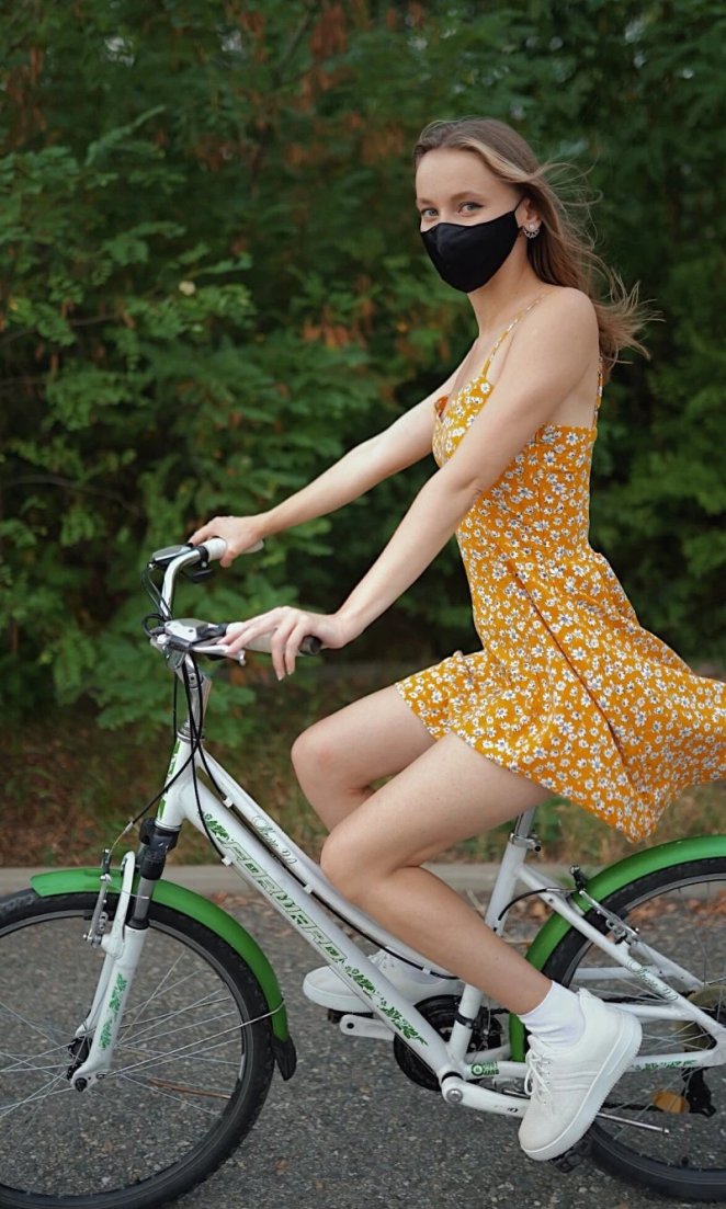 A girl rides a bike without panties