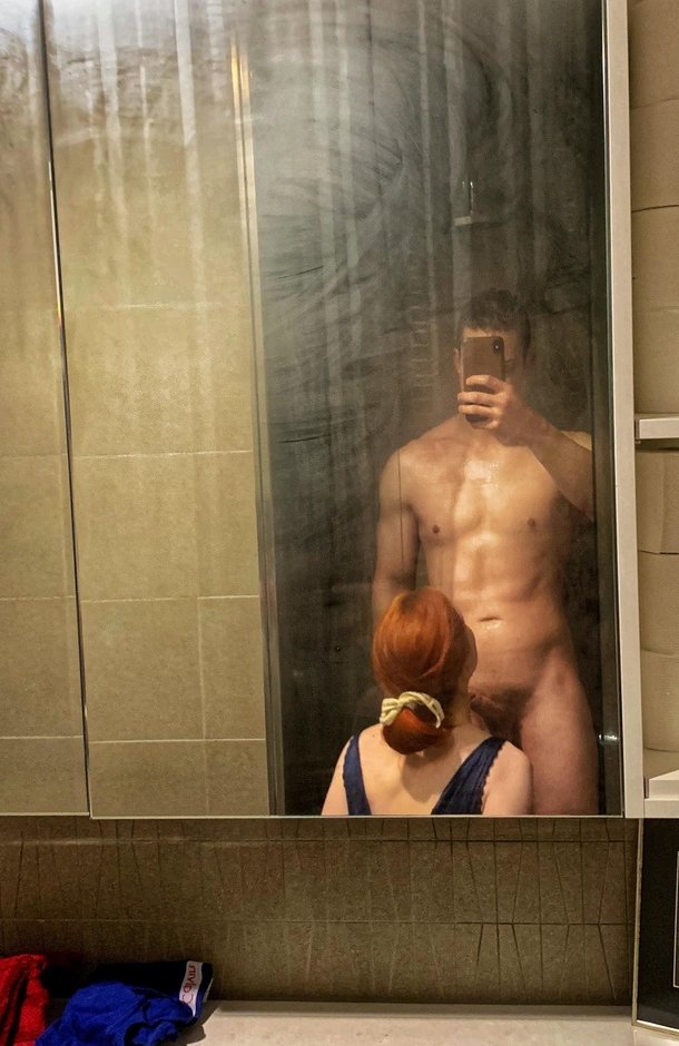 Bathroom mirrors are so handy for showing him what his wife is getting up to
