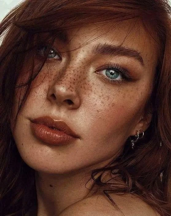 Freckled face blue eyed redhead