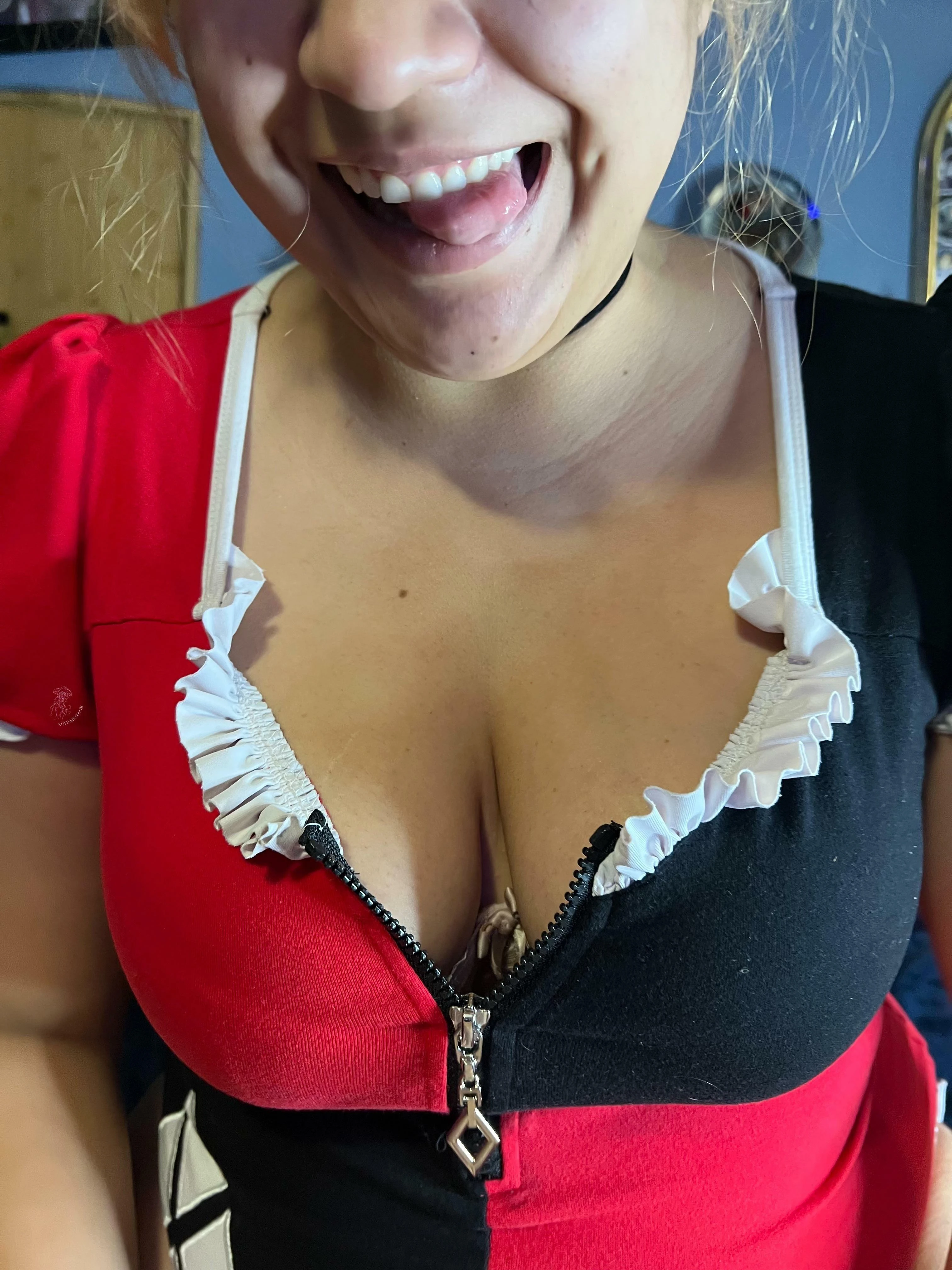 Goofy smile and bodysuit cleavage
