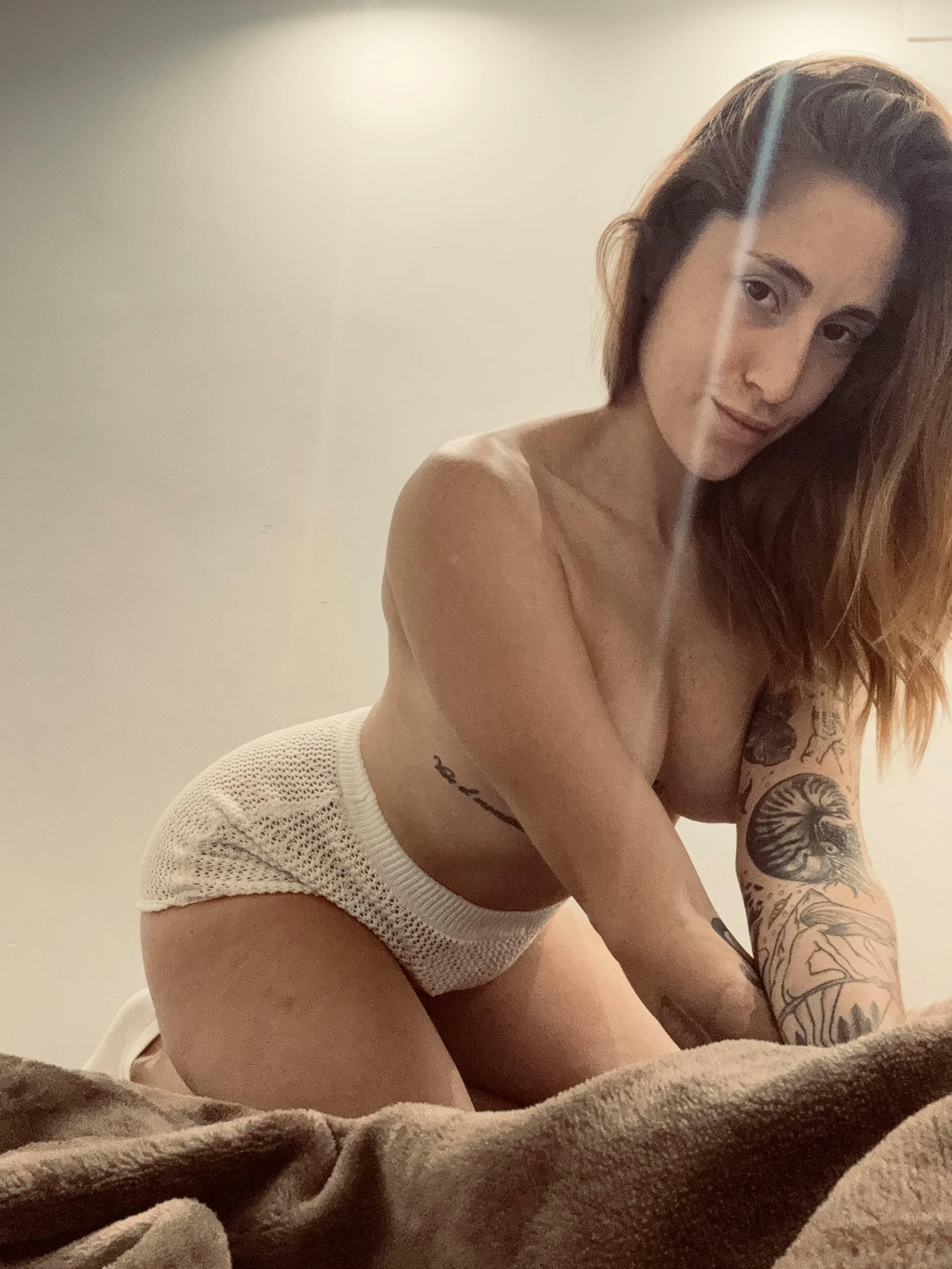 Smiling Latina woman posing confidently and looking directly at the camera