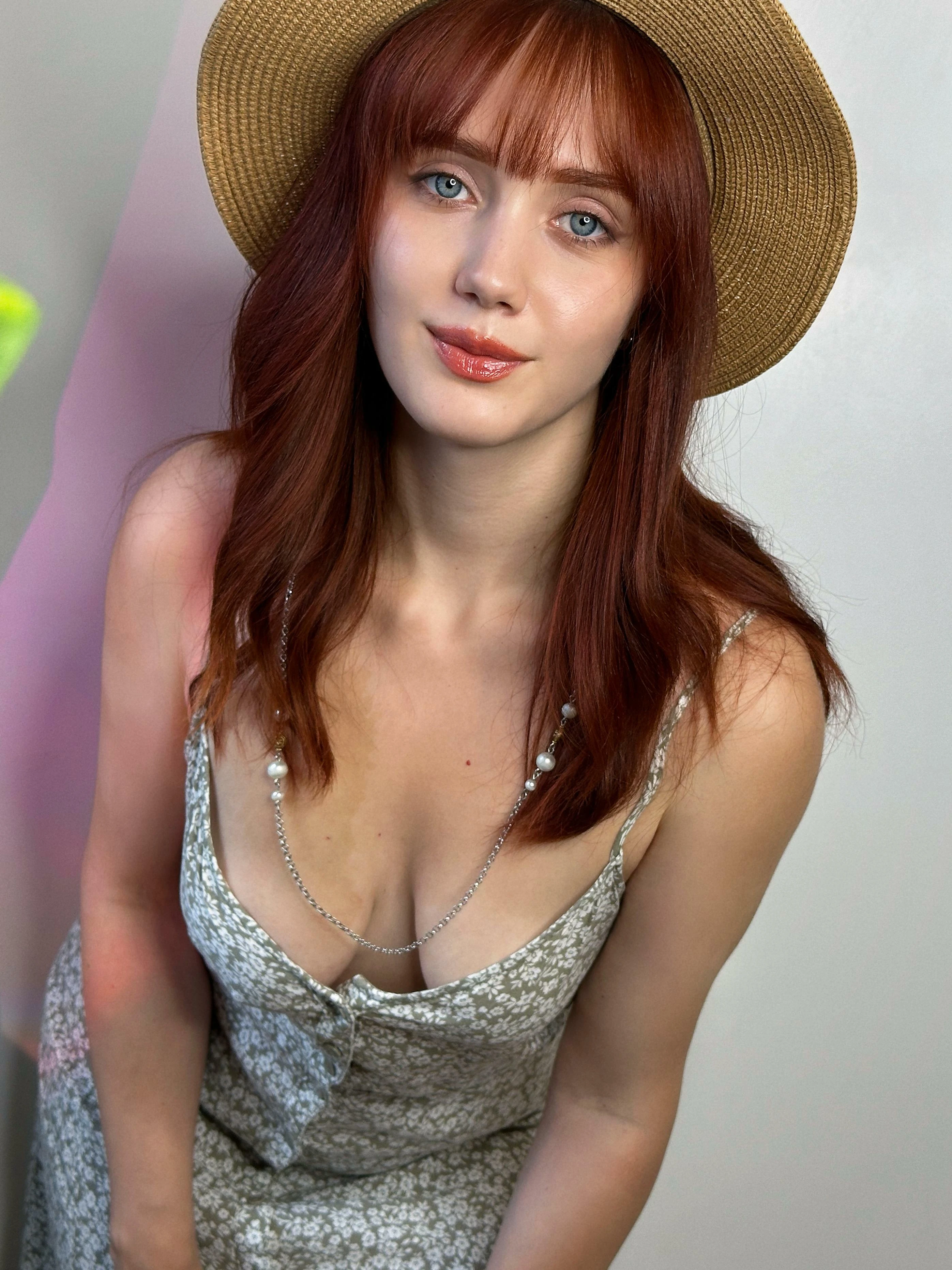 Woman in low cut top showing cleavage while preparing for an outdoor picnic