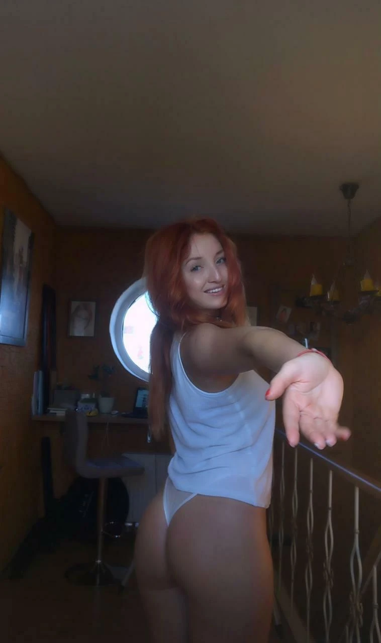 Person presenting their bare ass while looking back over their shoulder with direct eye contact