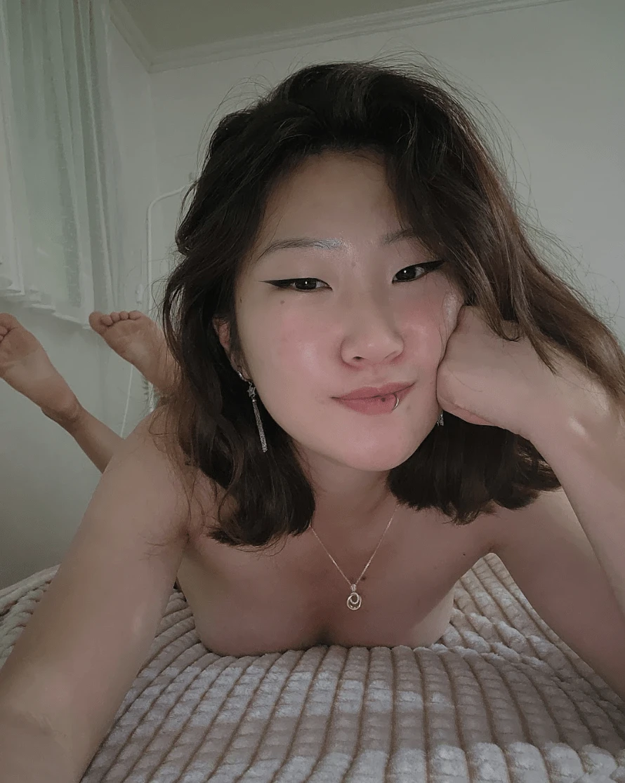 Smiling young woman with a warm and playful expression looking at camera