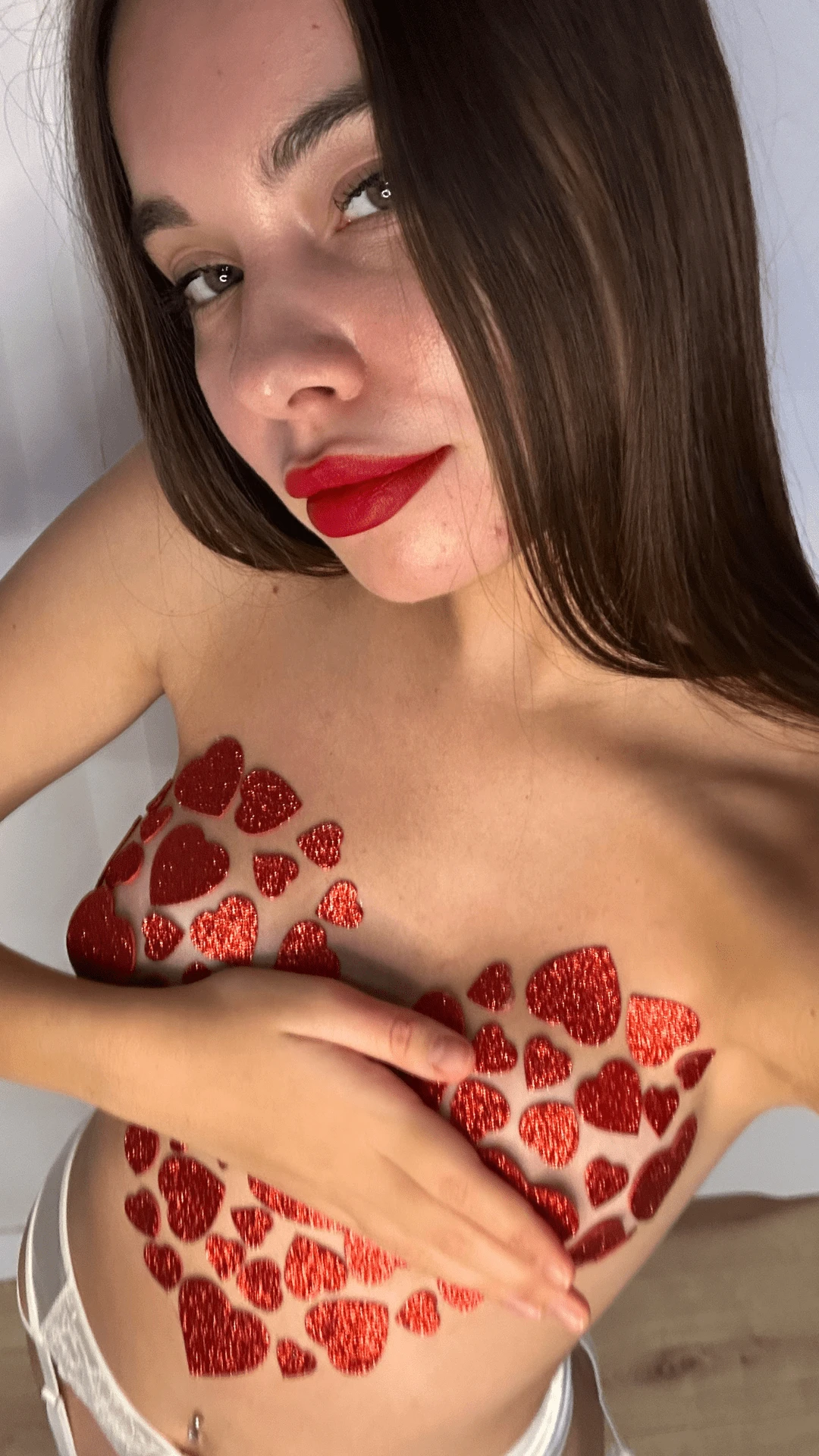 Young woman smiling warmly, enjoying the attention and feeling appreciated