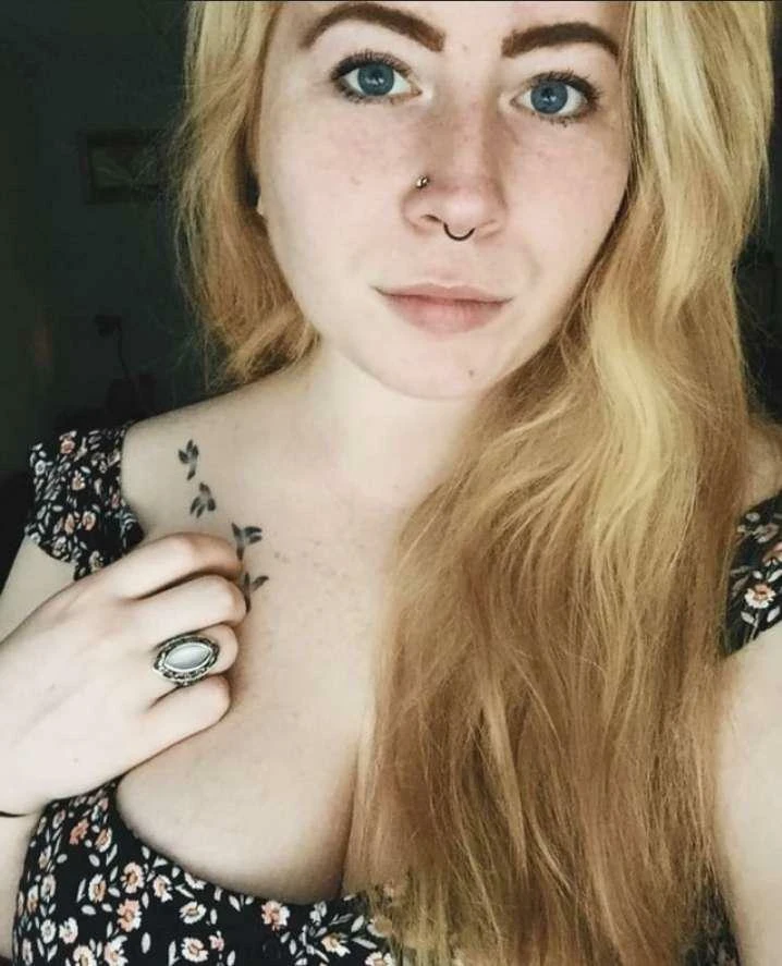 Sexy redhead woman posing confidently showing off her attractive figure